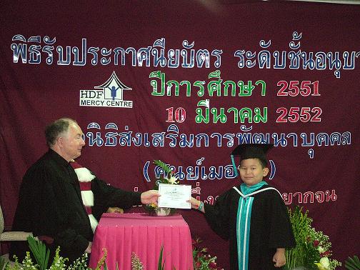 a graduate receives his  diploma
