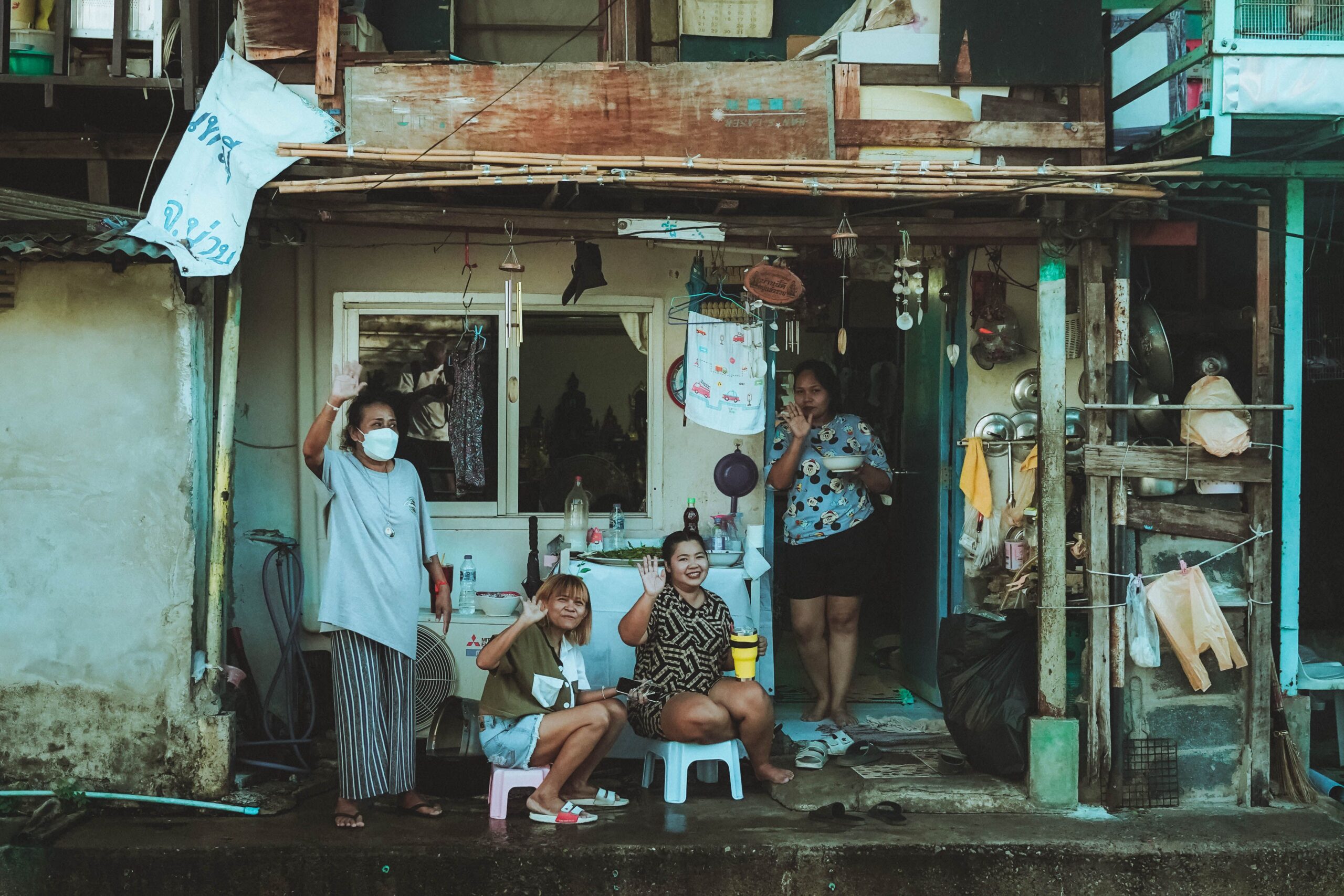 Women outside their home in Bangkok's Klong Toey community